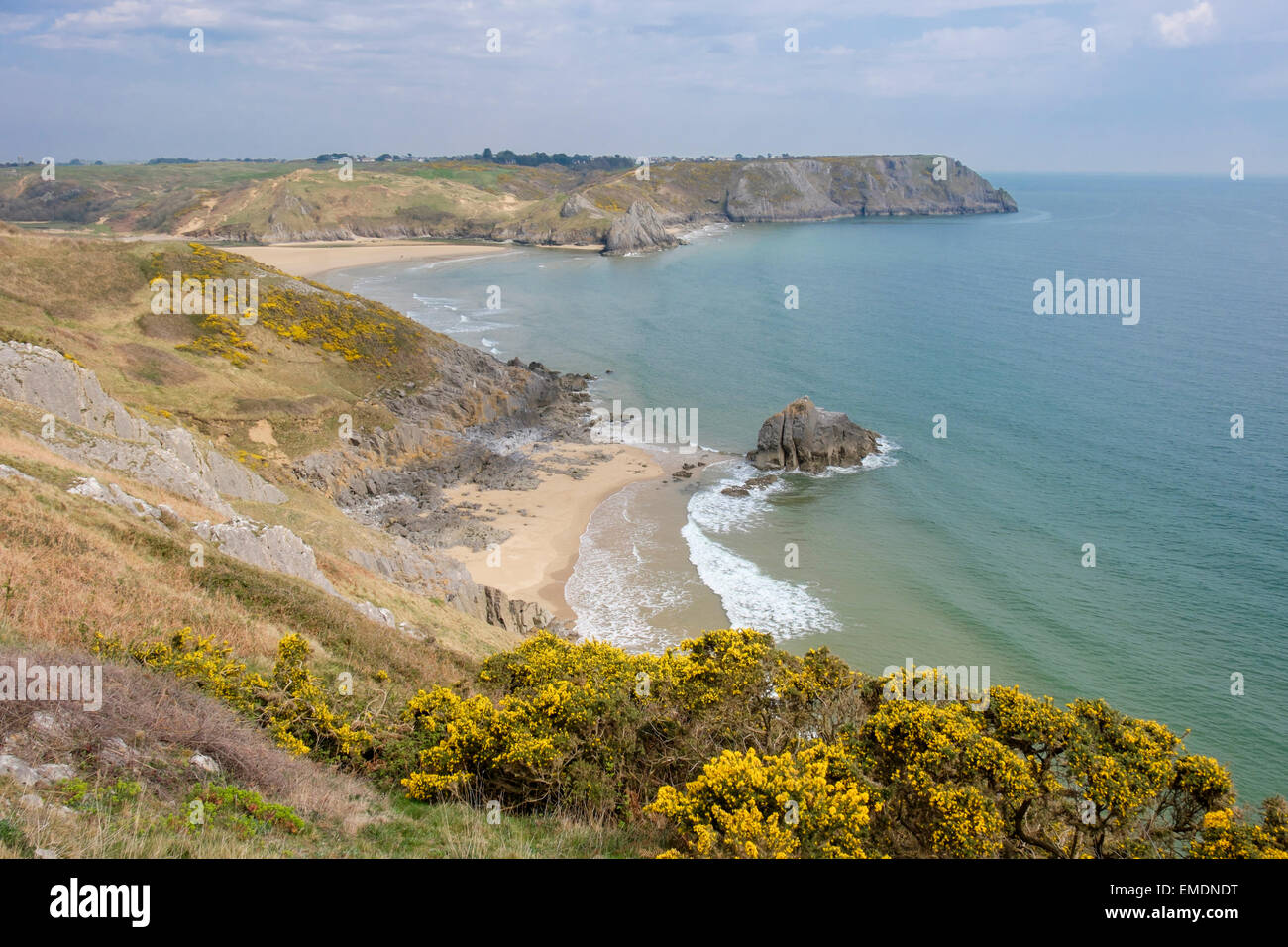 Elevated view down to Three Cliffs Bay from Great Tor in spring on Gower Peninsula. Penmaen Swansea West Glamorgan South Wales UK Britain Stock Photo