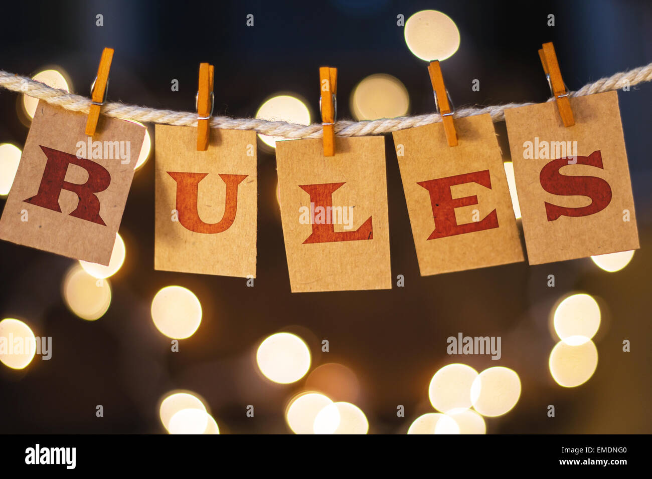 The word RULES printed on clothespin clipped cards in front of