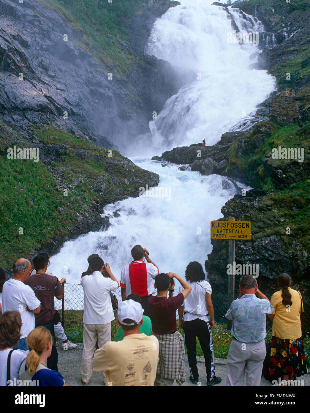 Tourists viewing Kjosfossen waterfall near Flam, Sogn og Fjordane, Norway Stock Photo