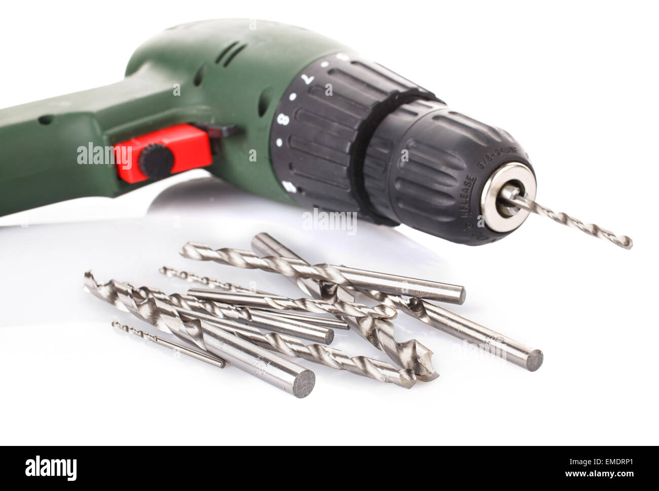 Drill and set of drill bits on white Stock Photo