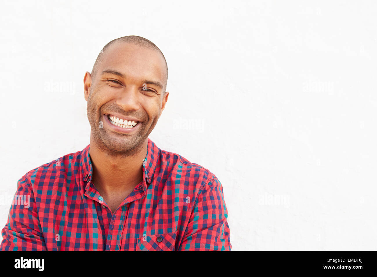 Portrait Of Man Standing Outdoors Against White Wall Stock Photo - Alamy