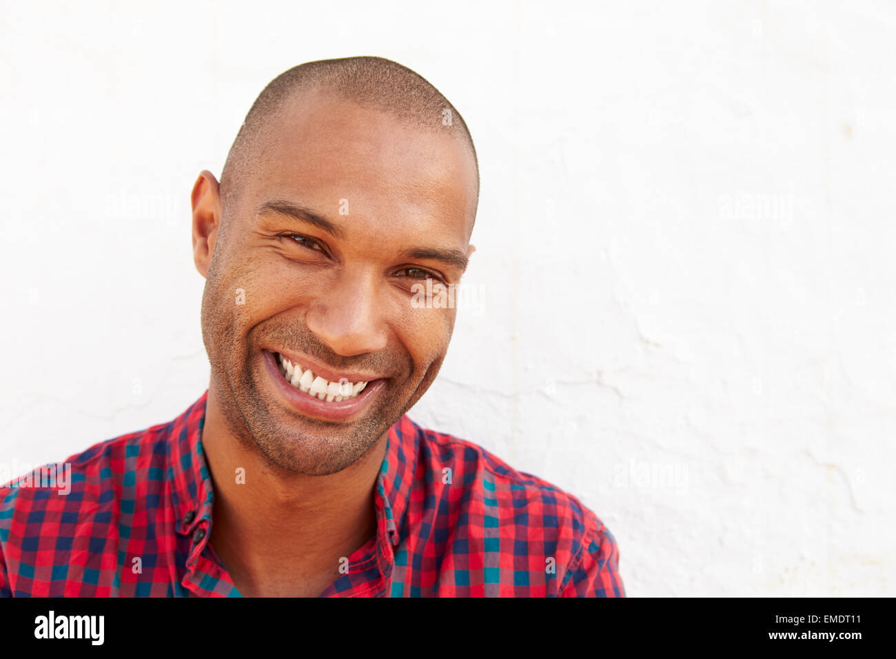 Portrait Of Man Standing Outdoors Against White Wall Stock Photo - Alamy