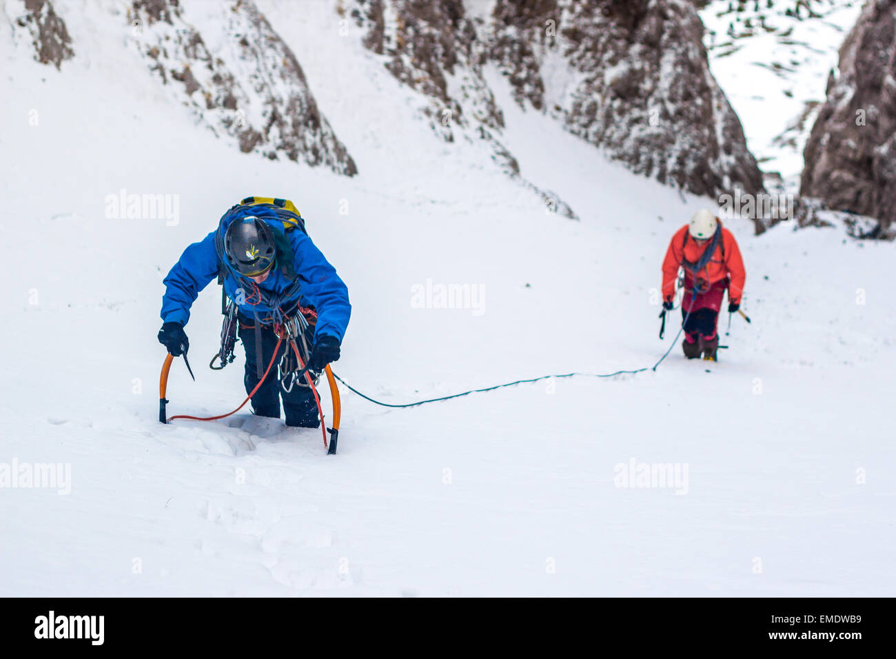 Couple of mountaineers ascending. Stock Photo