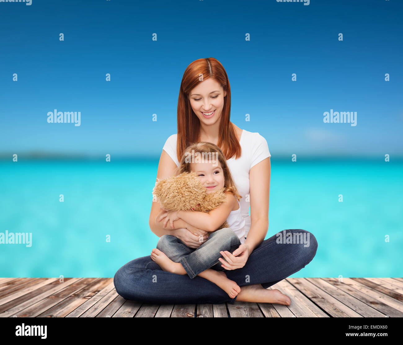 happy mother with adorable girl and teddy bear Stock Photo - Alamy