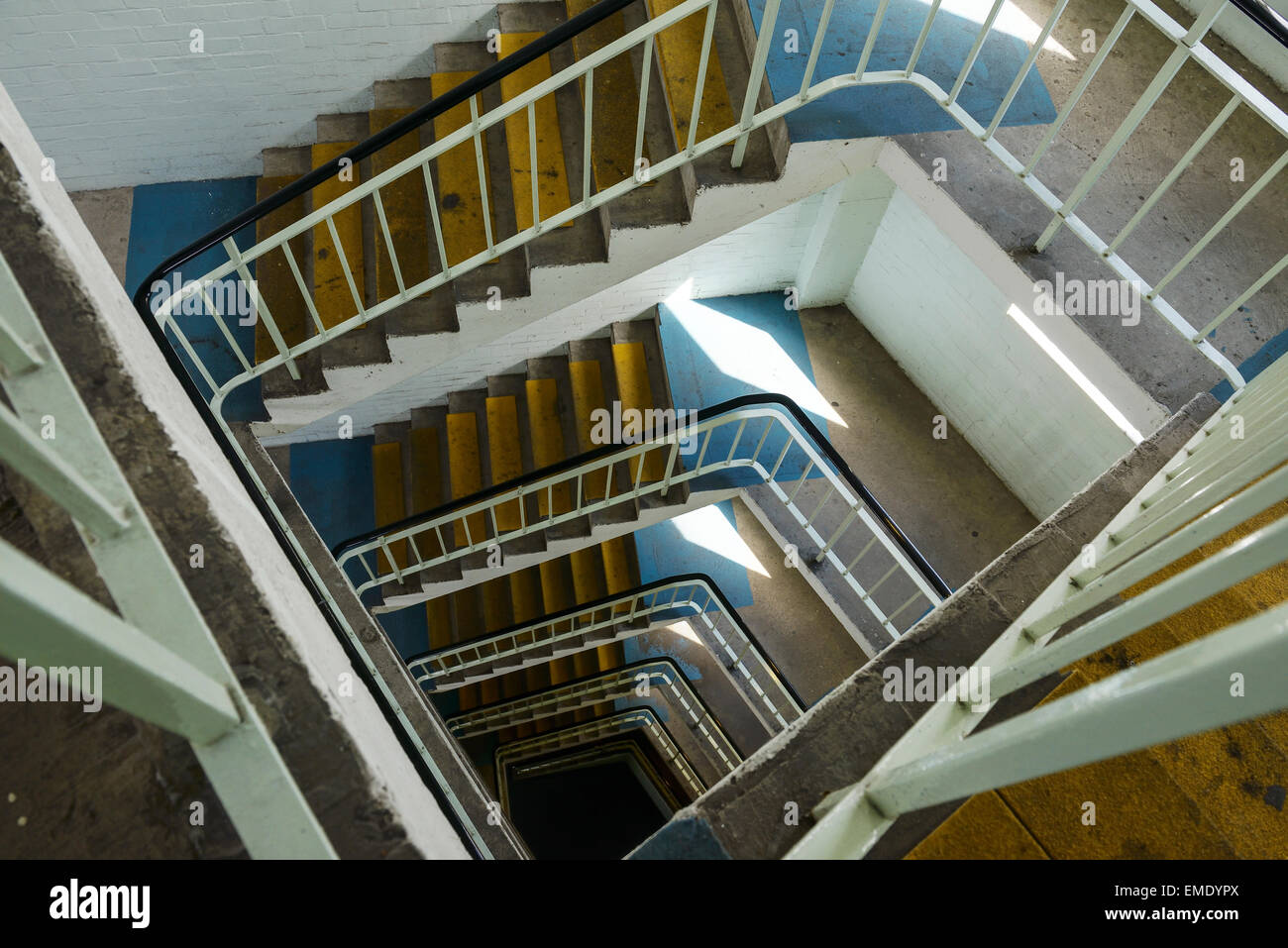 Old spiral stairwell in a multistorey carpark UK Stock Photo