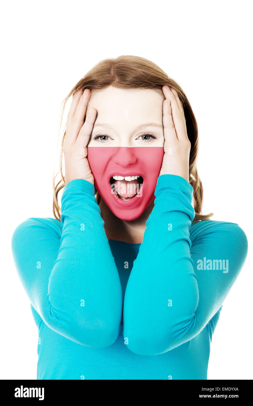 Woman with Polish flag on face. Stock Photo