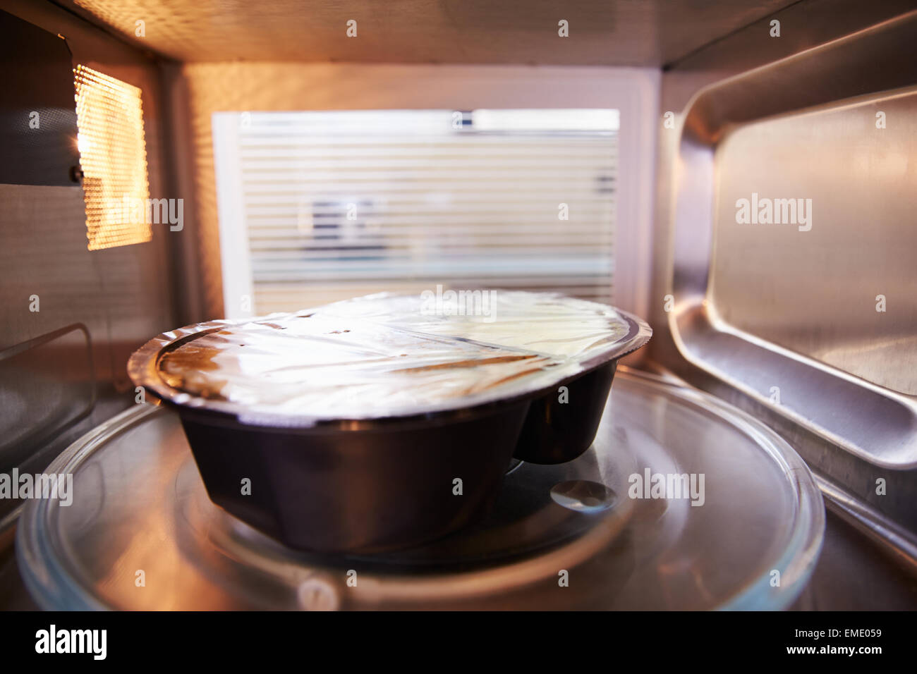TV Dinner Cooking Inside Microwave Oven Stock Photo Alamy