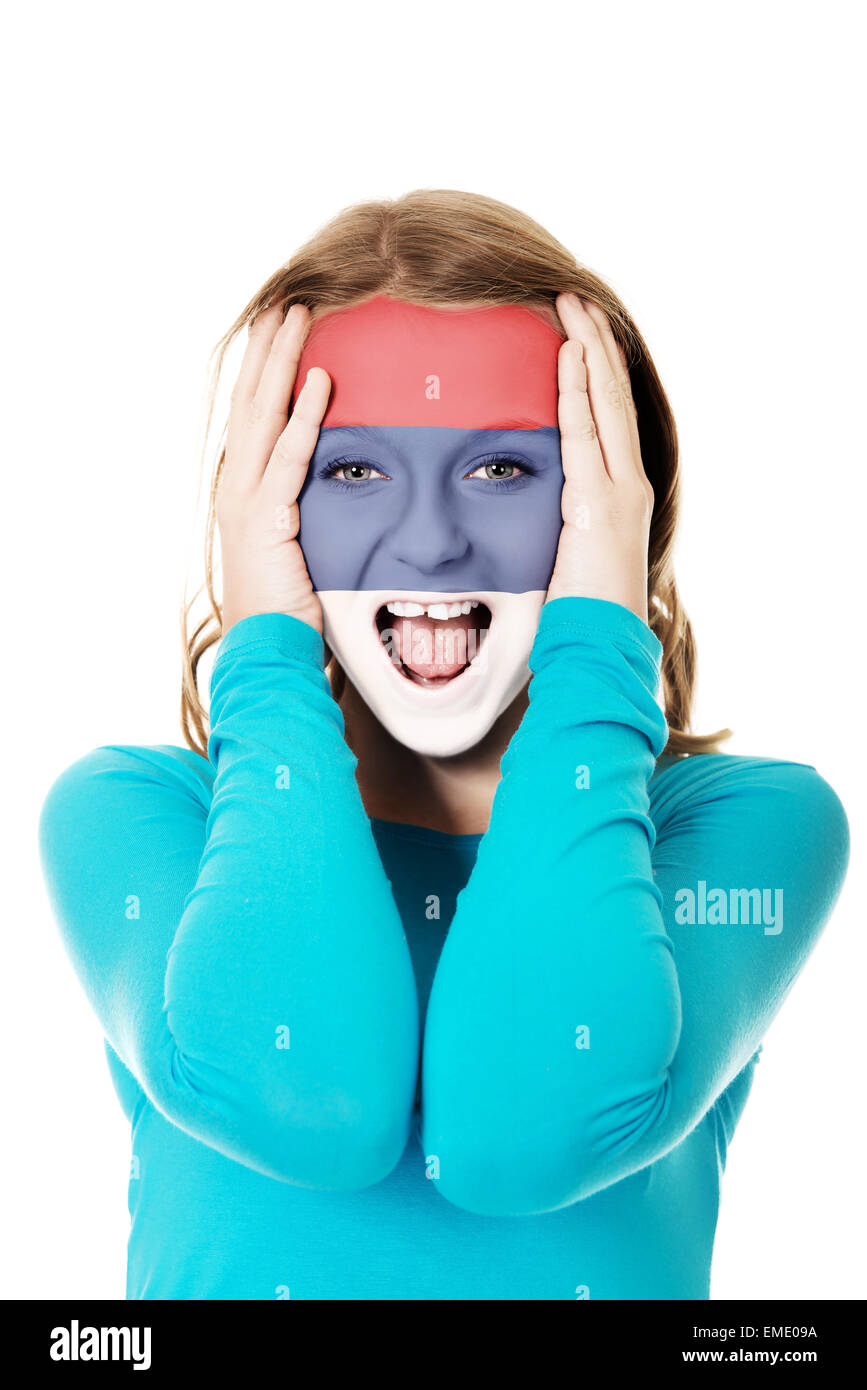 Woman with Serbia flag on face. Stock Photo