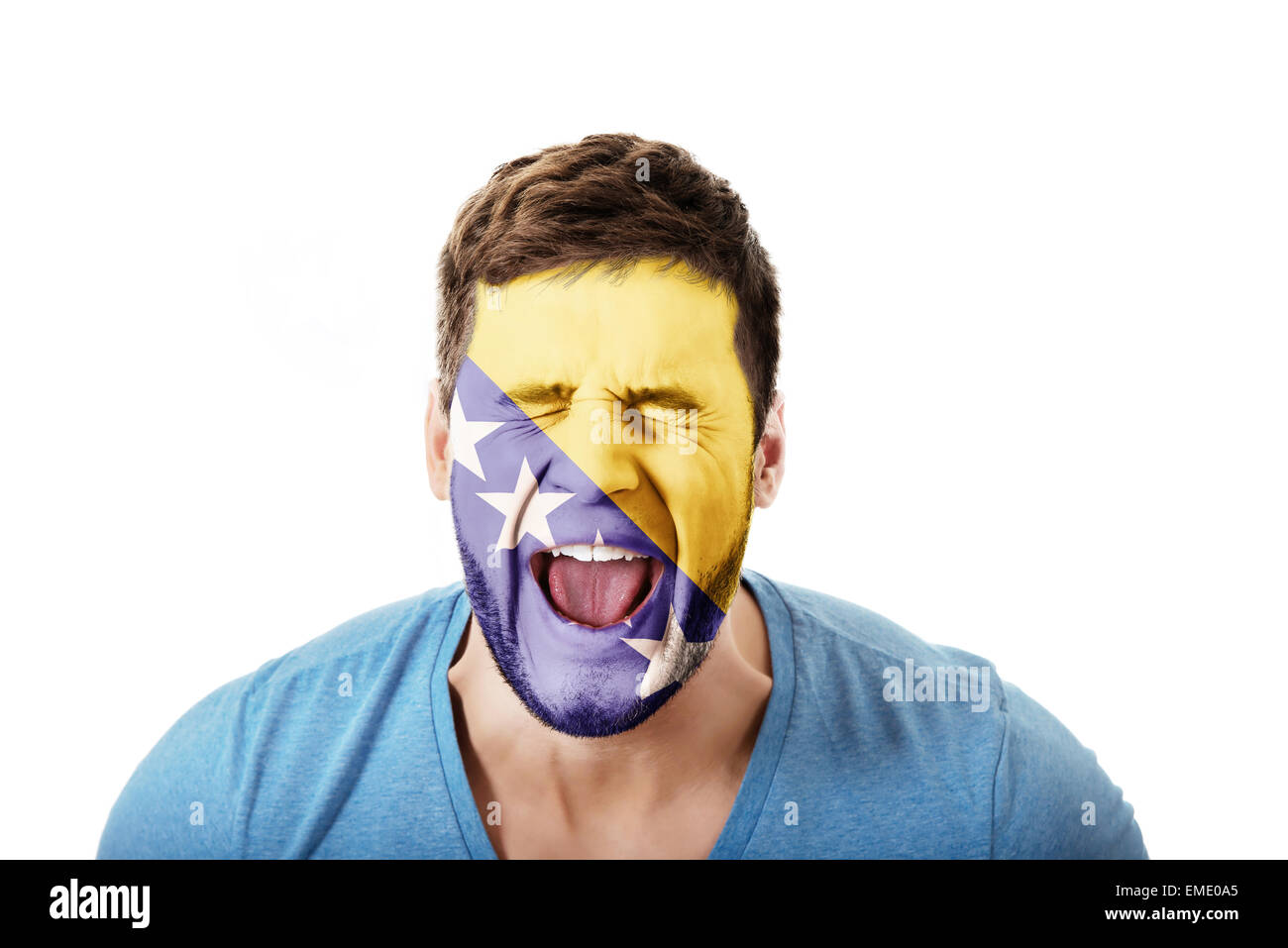Screaming man with Bosnia and Herzegovina flag painted on face. Stock Photo