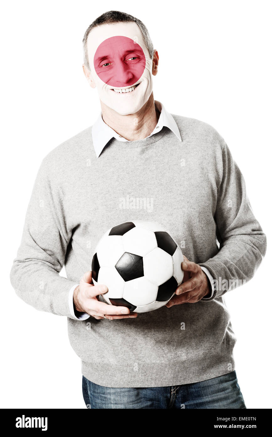 Mature man with Japan flag on face. Stock Photo