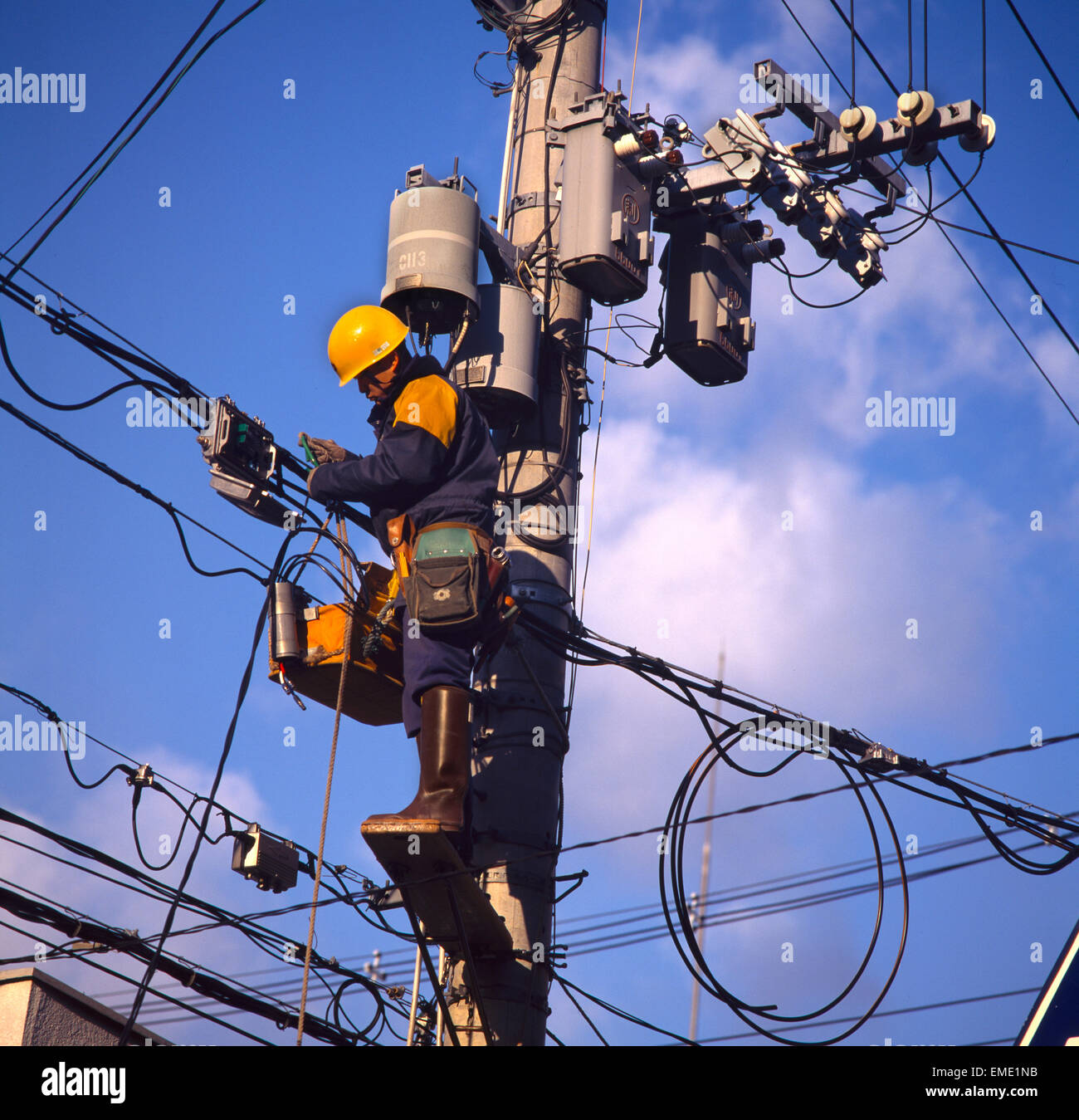 Kobe Japan Electrician working on Power Lines Stock Photo Alamy