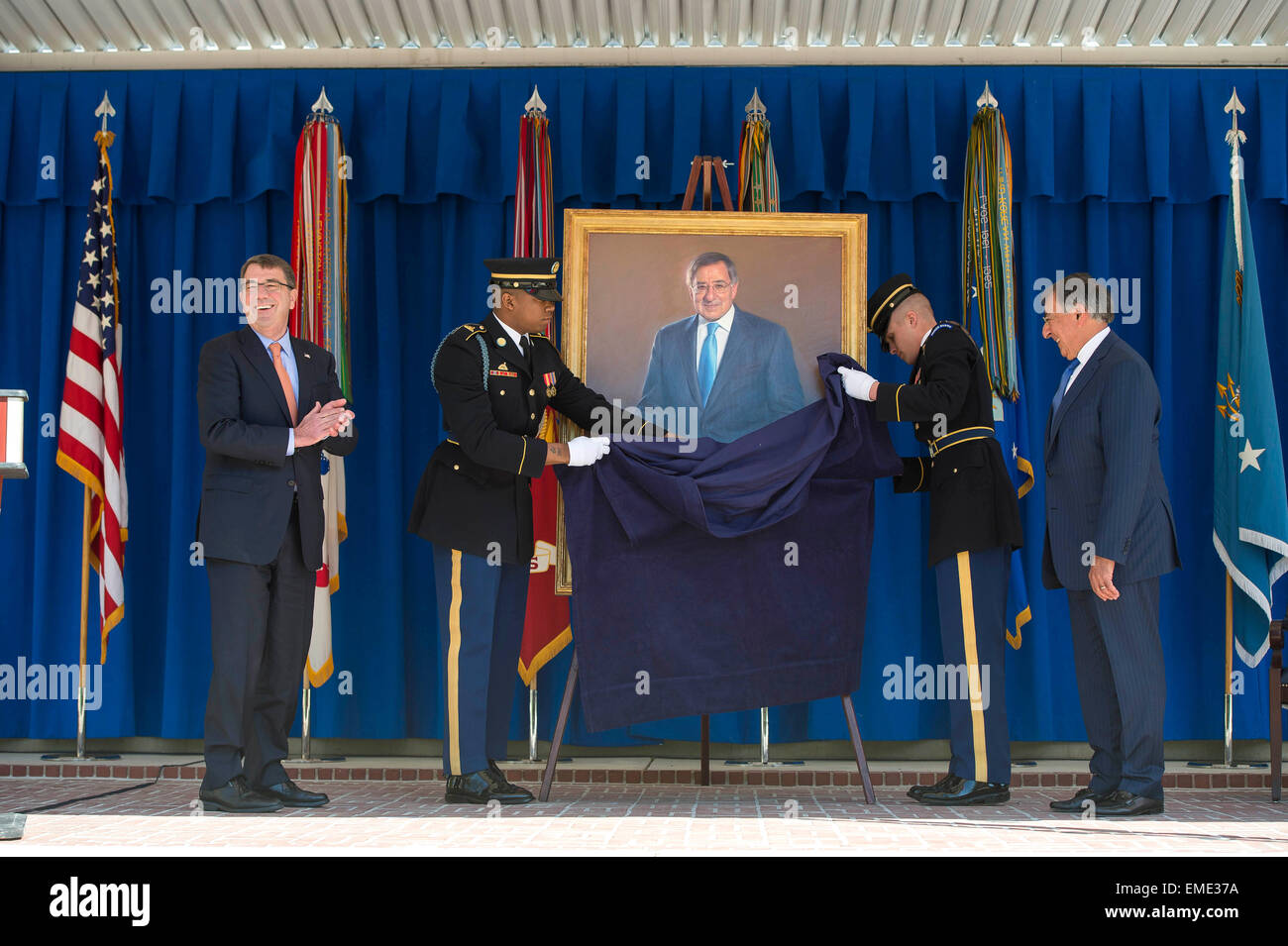 US Defense Secretary Ashton Carter and Former Secretary of Defense Leon Panetta watch as Panetta's official portrait is unveiled at the Pentagon April 16, 2015 in Arlington, Virginia. Panetta served as the 23rd Secretary of Defense from 2011-2013. Stock Photo