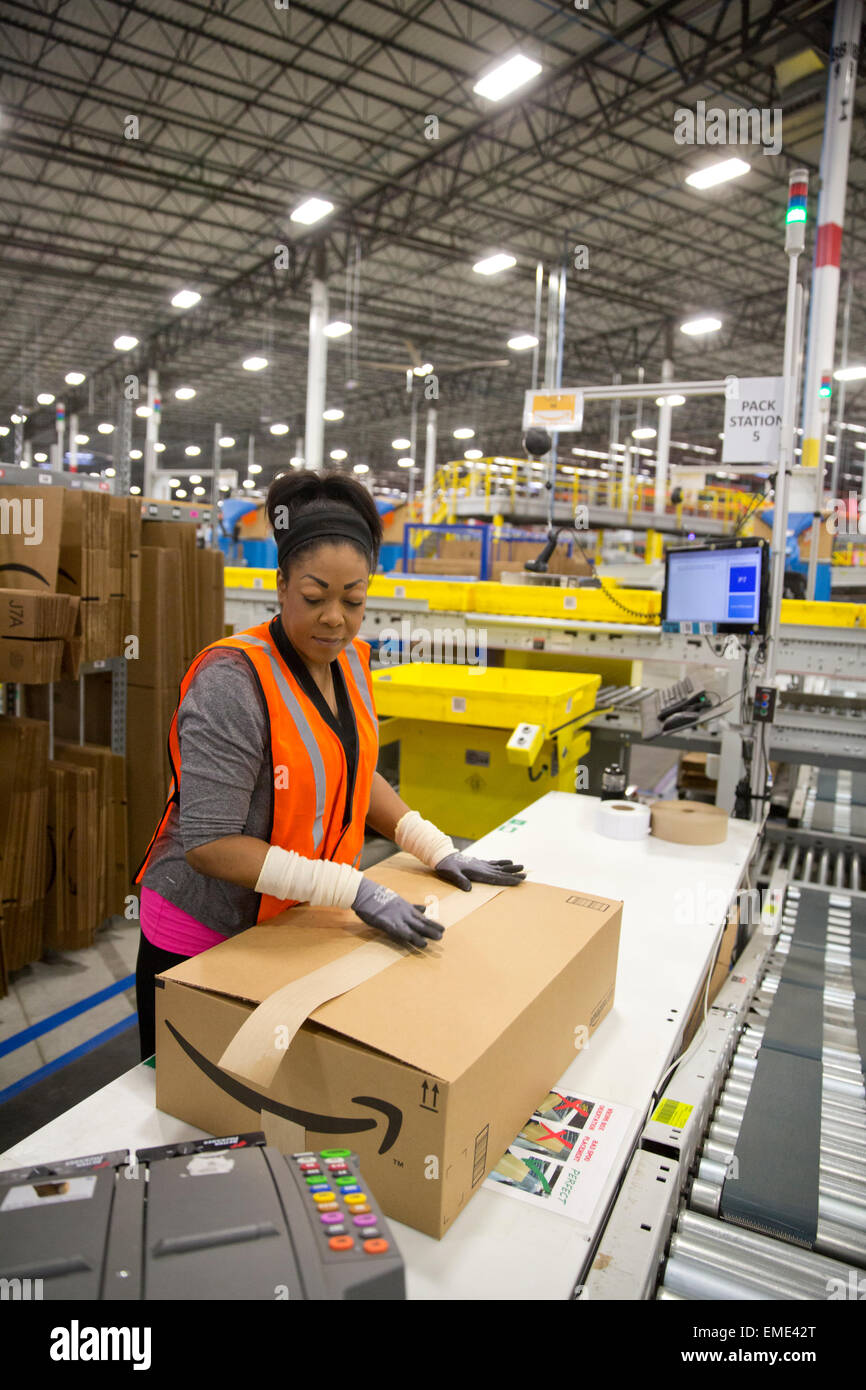 woman employee working at the 1.25 million square foot Amazon shipping center in Schertz, Texas. Stock Photo