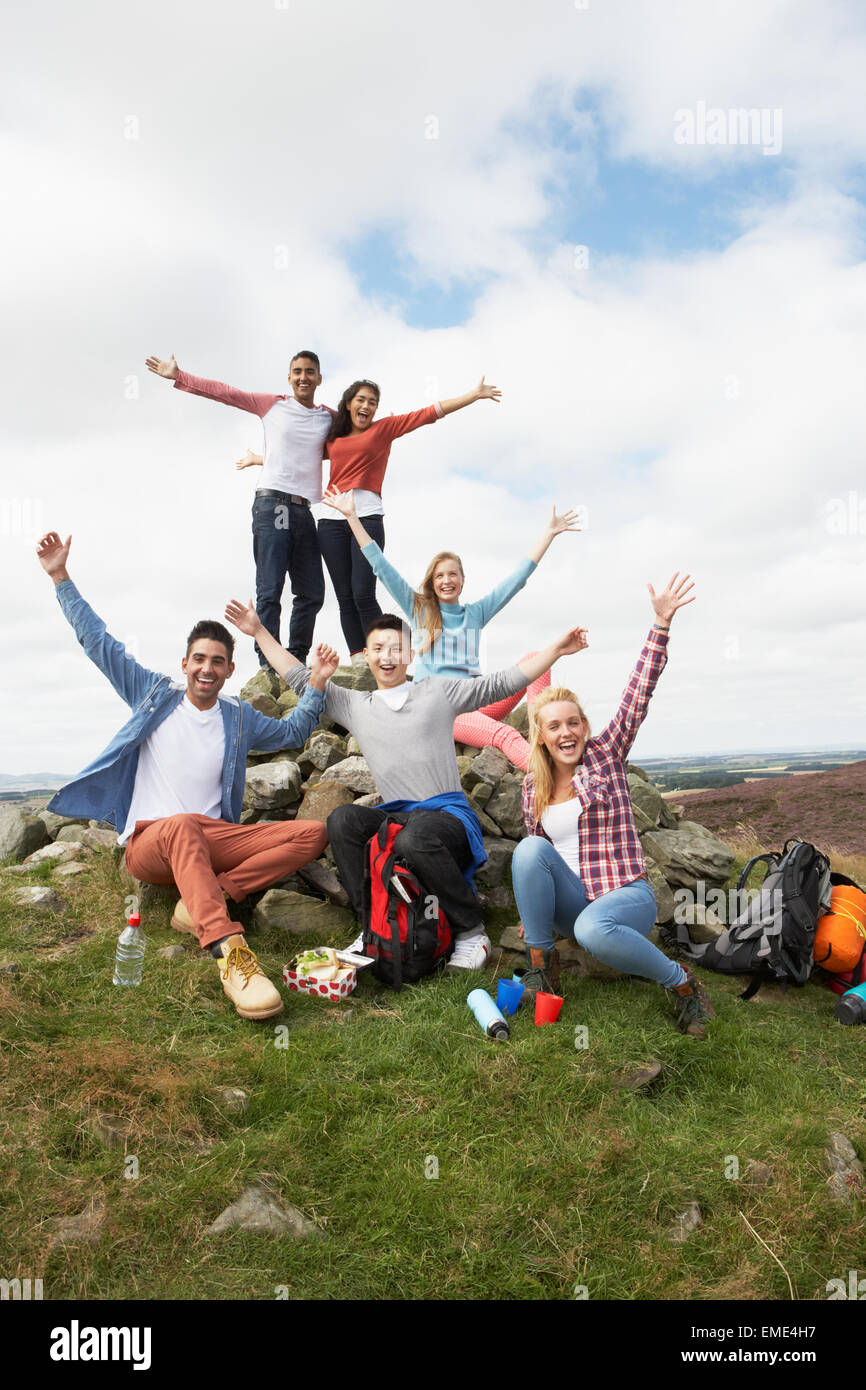 Group Of Young People Hiking In Countryside Stock Photo - Alamy
