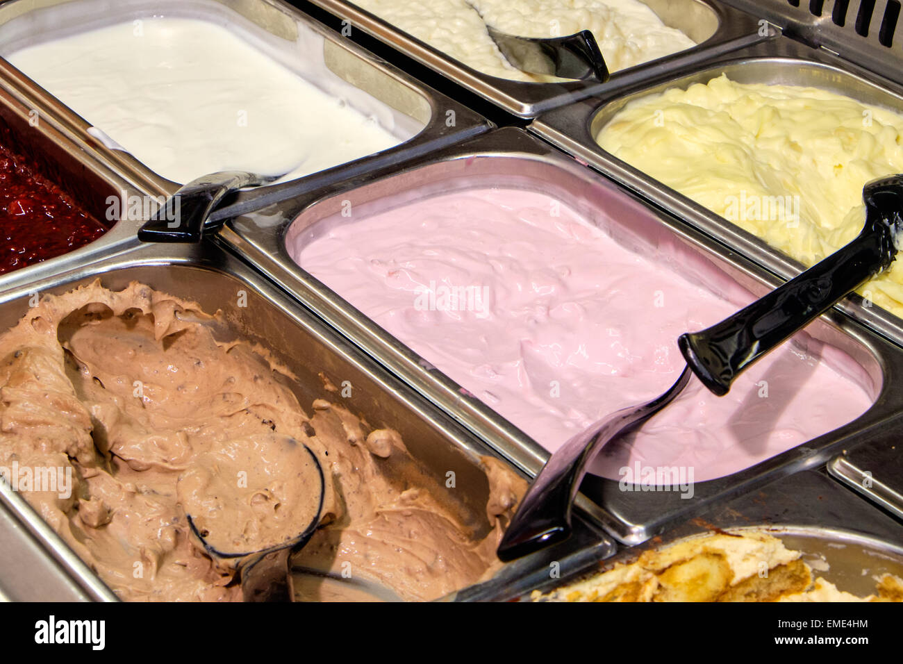 A variety of desserts at a buffet seen in a restaurant Stock Photo