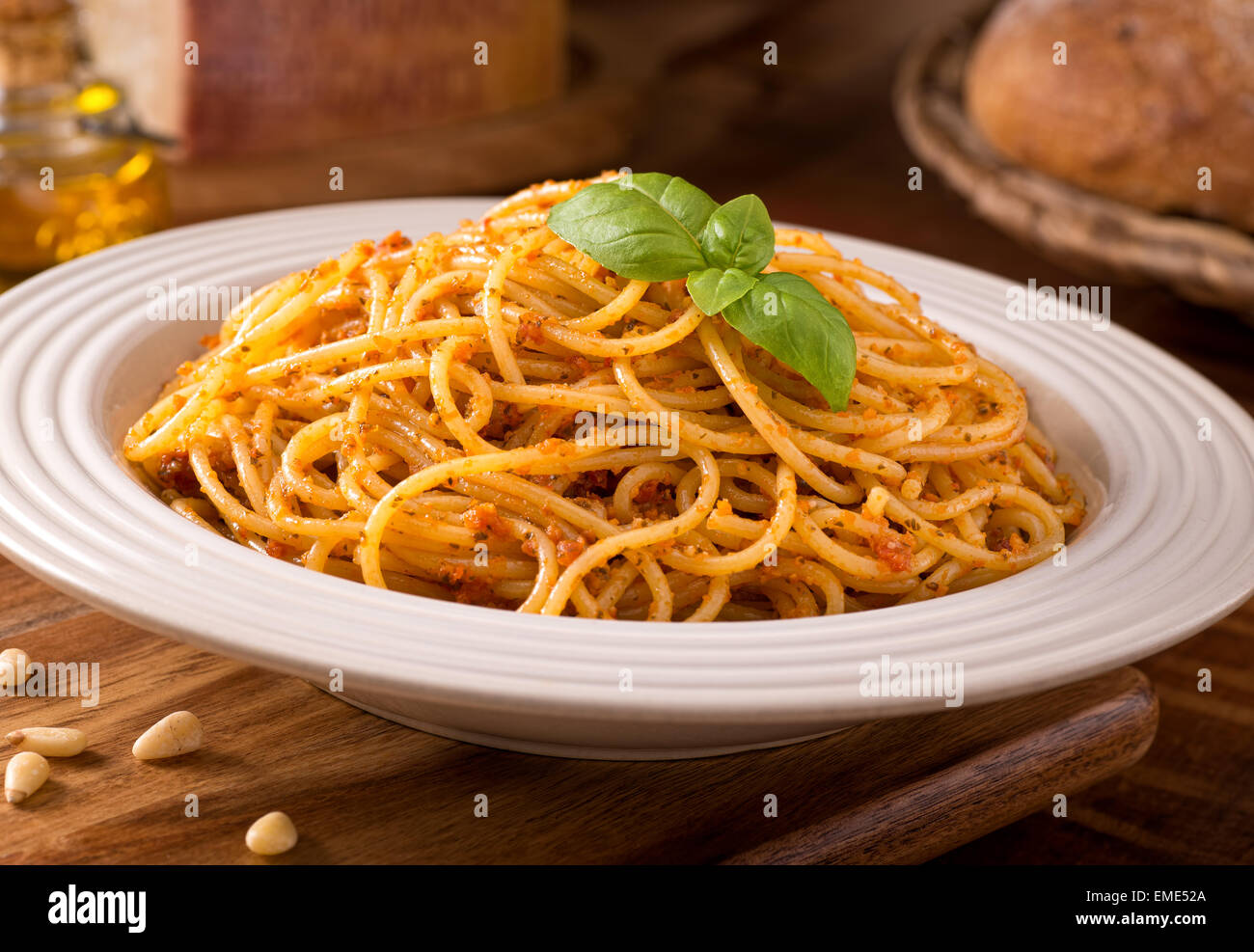 A delicious bowl of fresh spaghetti with sicilian red pesto. Stock Photo