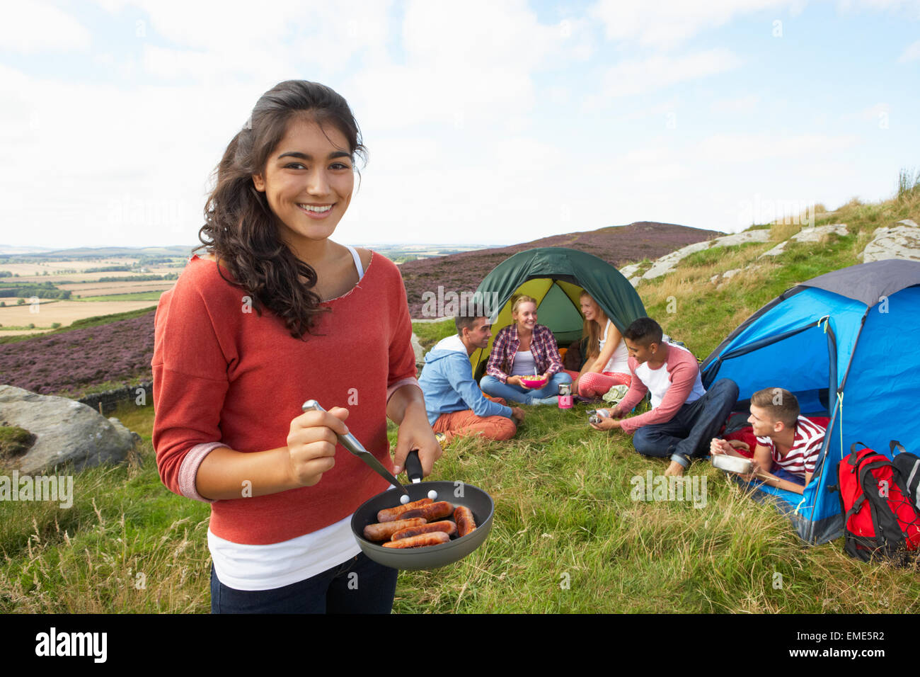 Group Of Young People On Camping Trip In Countryside Stock Photo