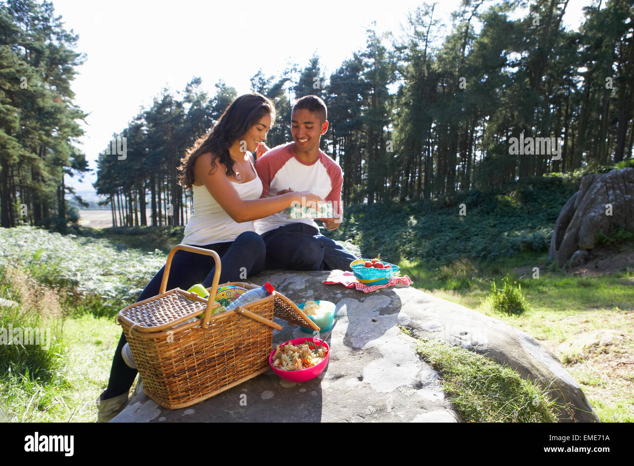 Young Couple Enjoying Picnic In Countryside Stock Photo