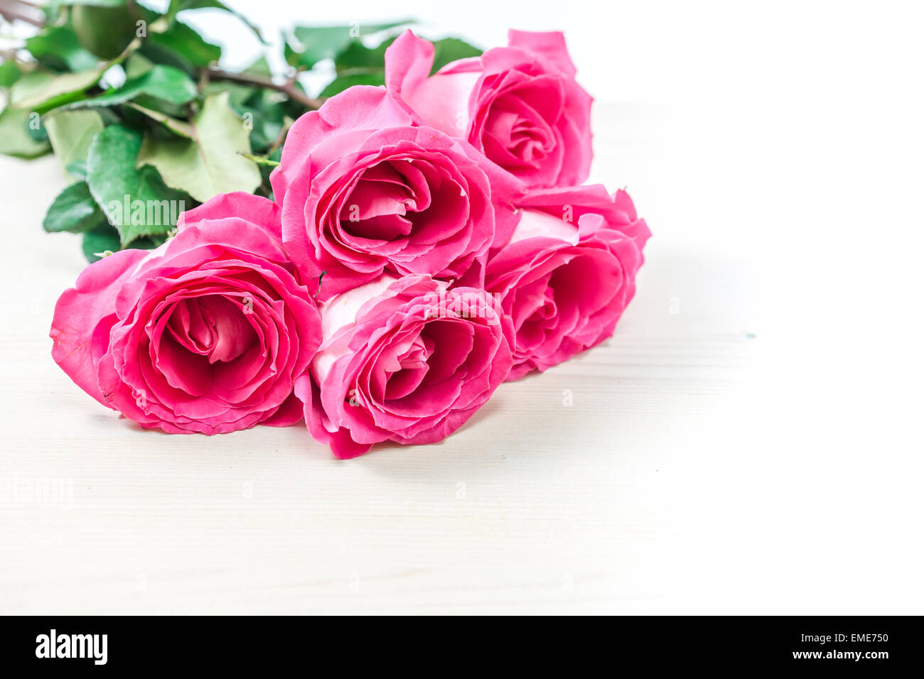 Bouquet of beautiful pink roses on white background Stock Photo - Alamy