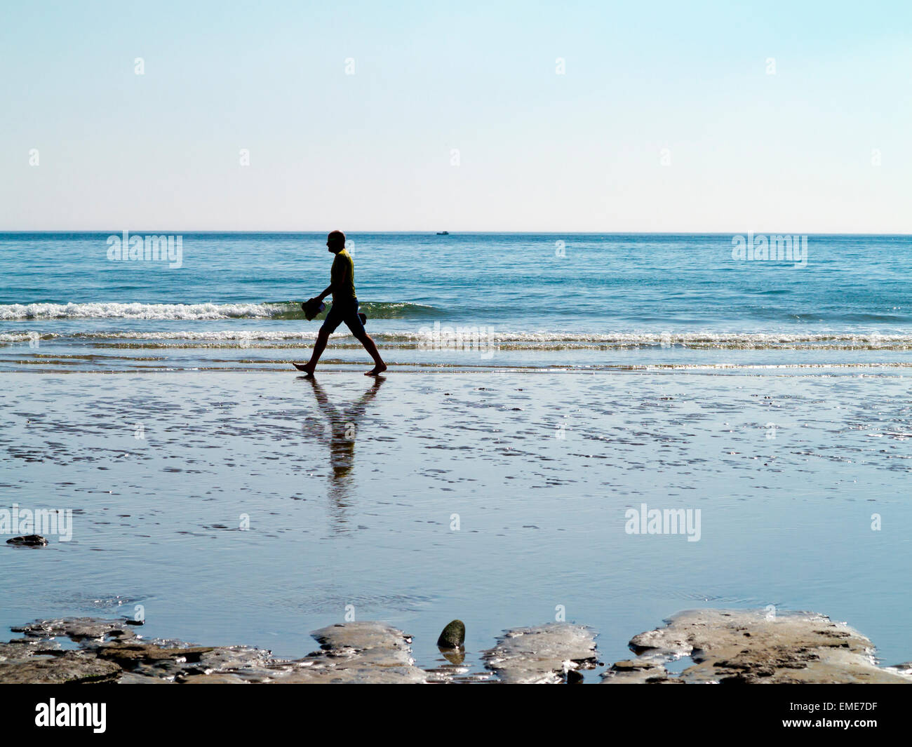 Walking barefoot along beach hi-res stock photography and images - Alamy