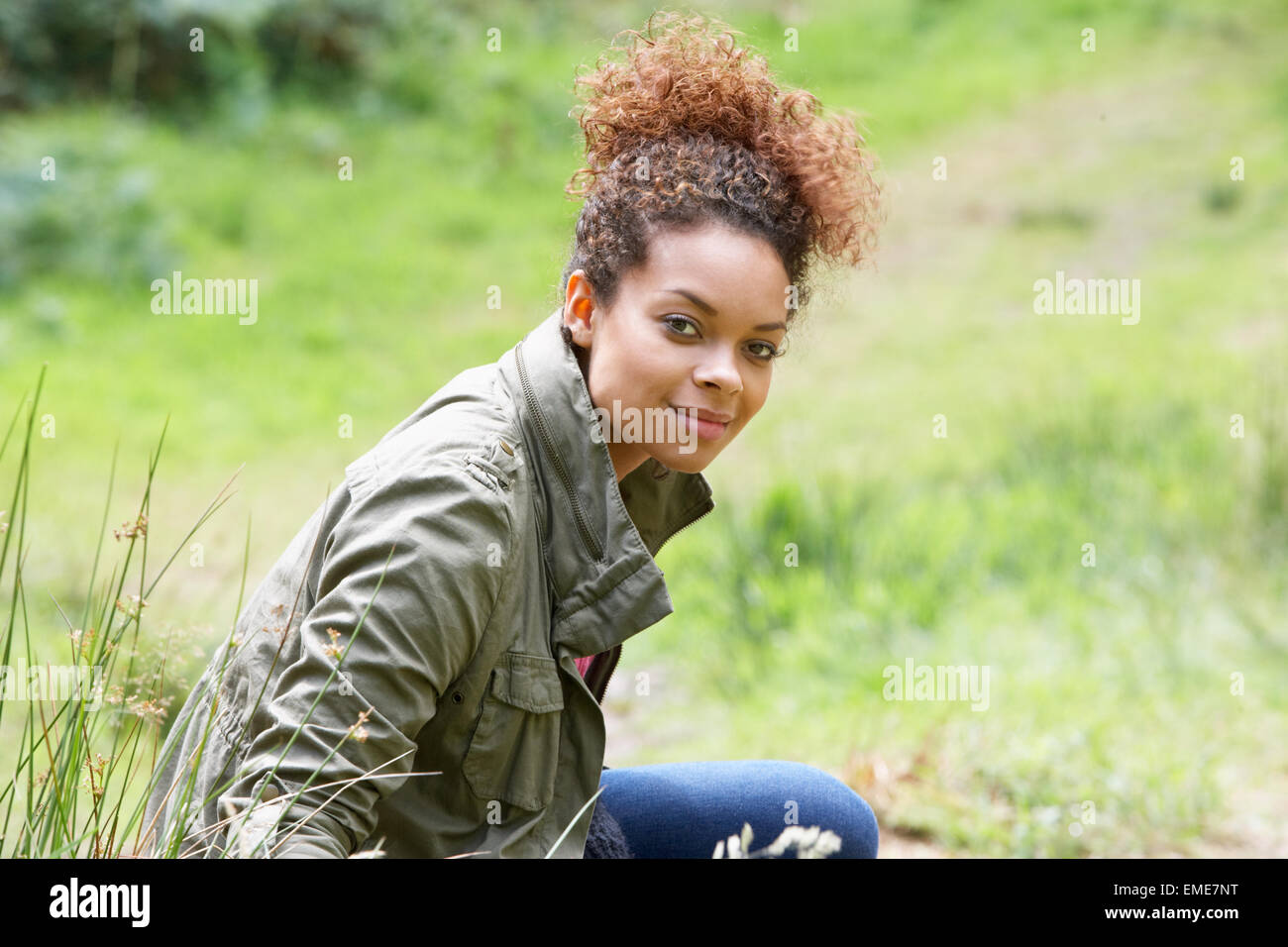 Woman Enjoying Walk In Countryside Stock Photo