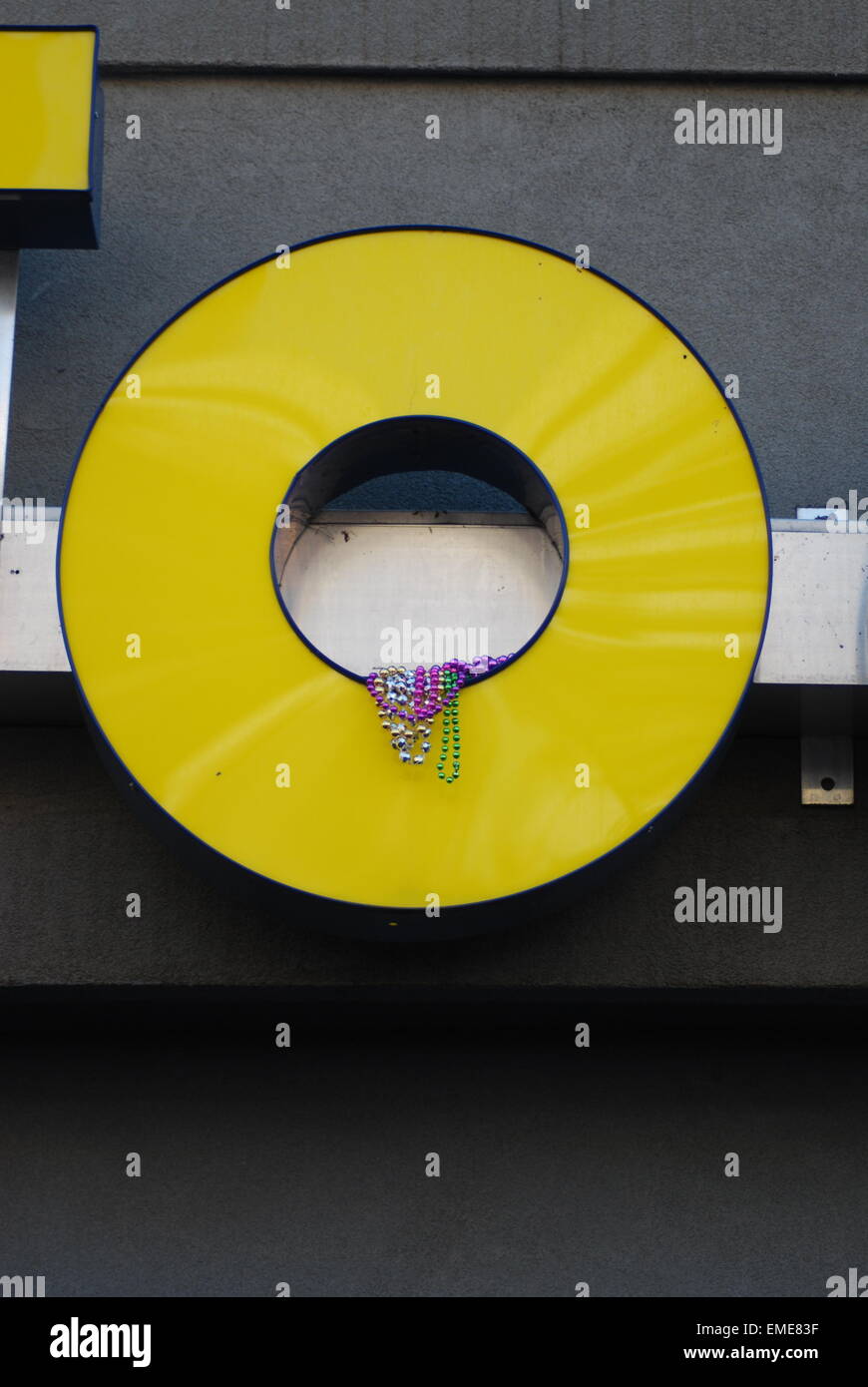 Beads caught in shop sign during Mardi Gras in New Orleans Louisiana