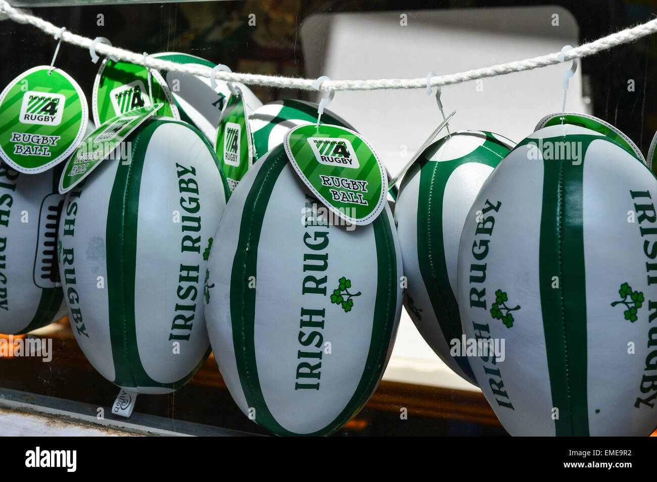 Miniature Irish Rugby balls on sale in a shop window, Londonderry (Derry), Northern Ireland Stock Photo