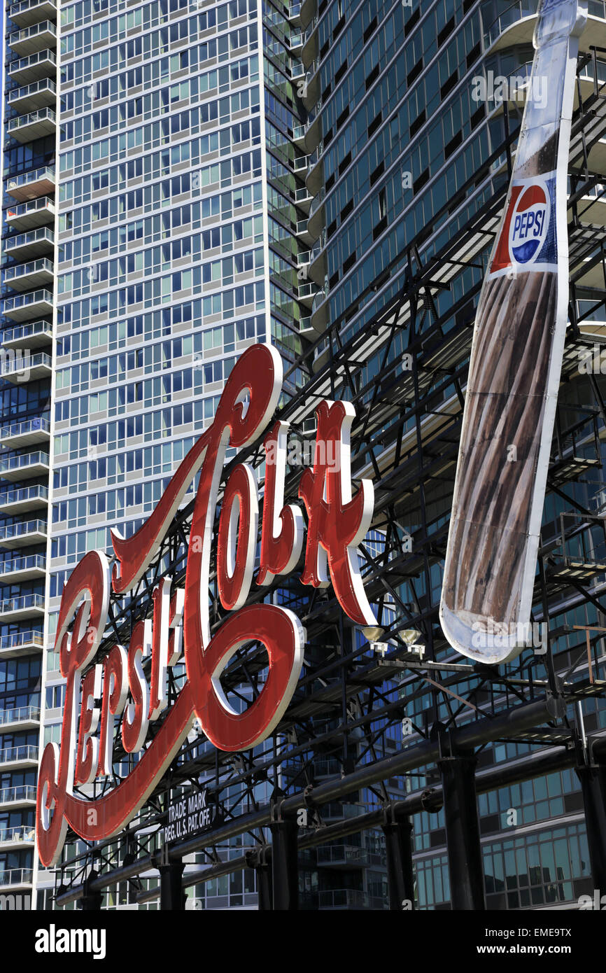 Pepsi Cola billboard in Gantry Plaza State Park with high-rise apartment building in background.Long Island City.Queens, New York. USA Stock Photo