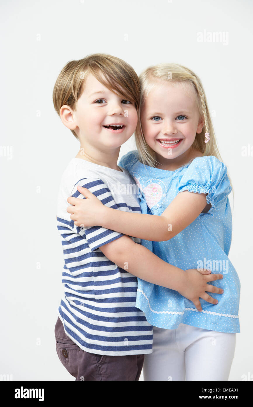 Two Pre School Pupils Hugging One Another Stock Photo