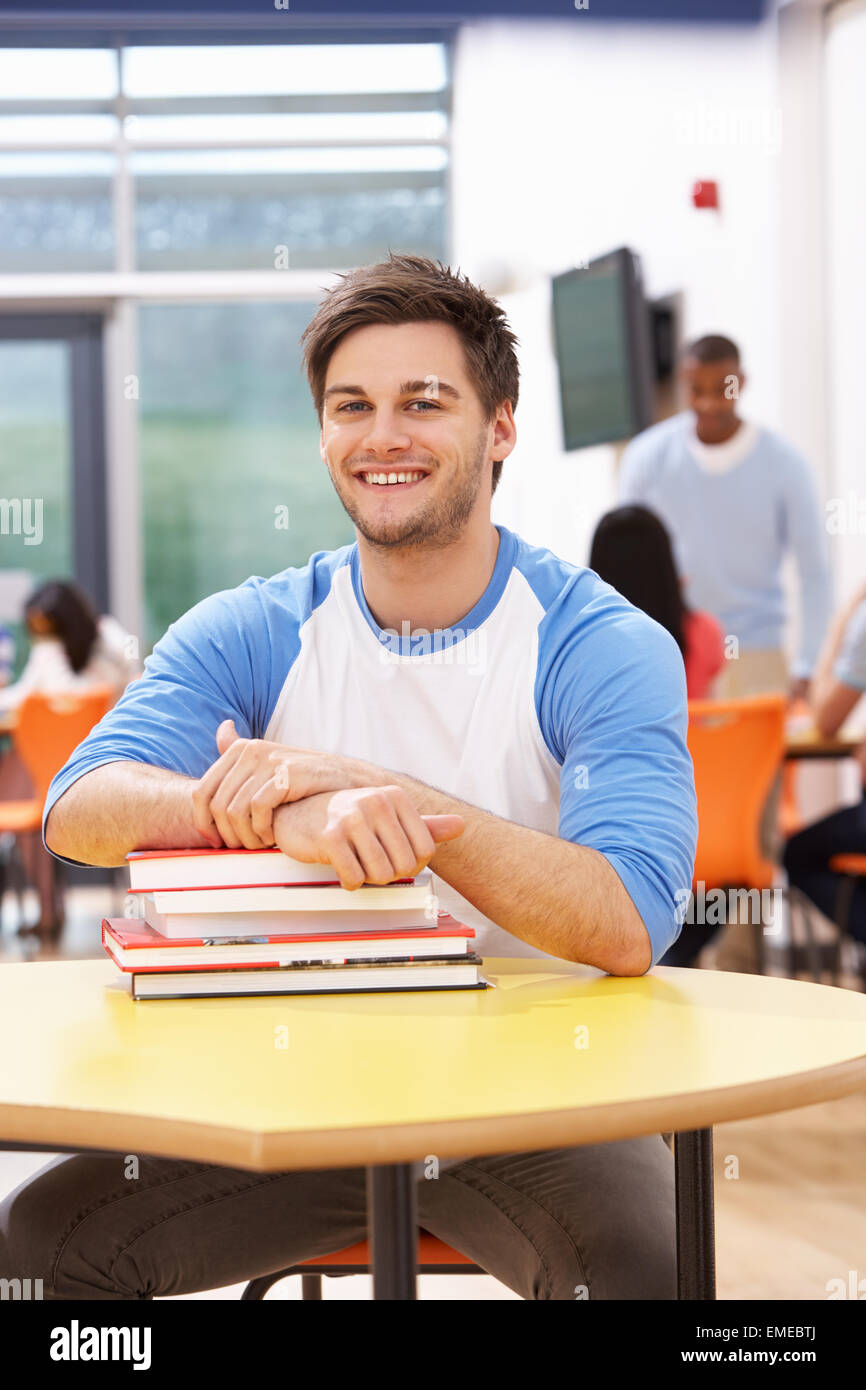 Male Student Studying In Classroom With Books Stock Photo - Alamy