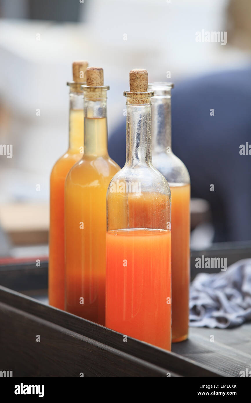 vivid drink in glass bottles Stock Photo
