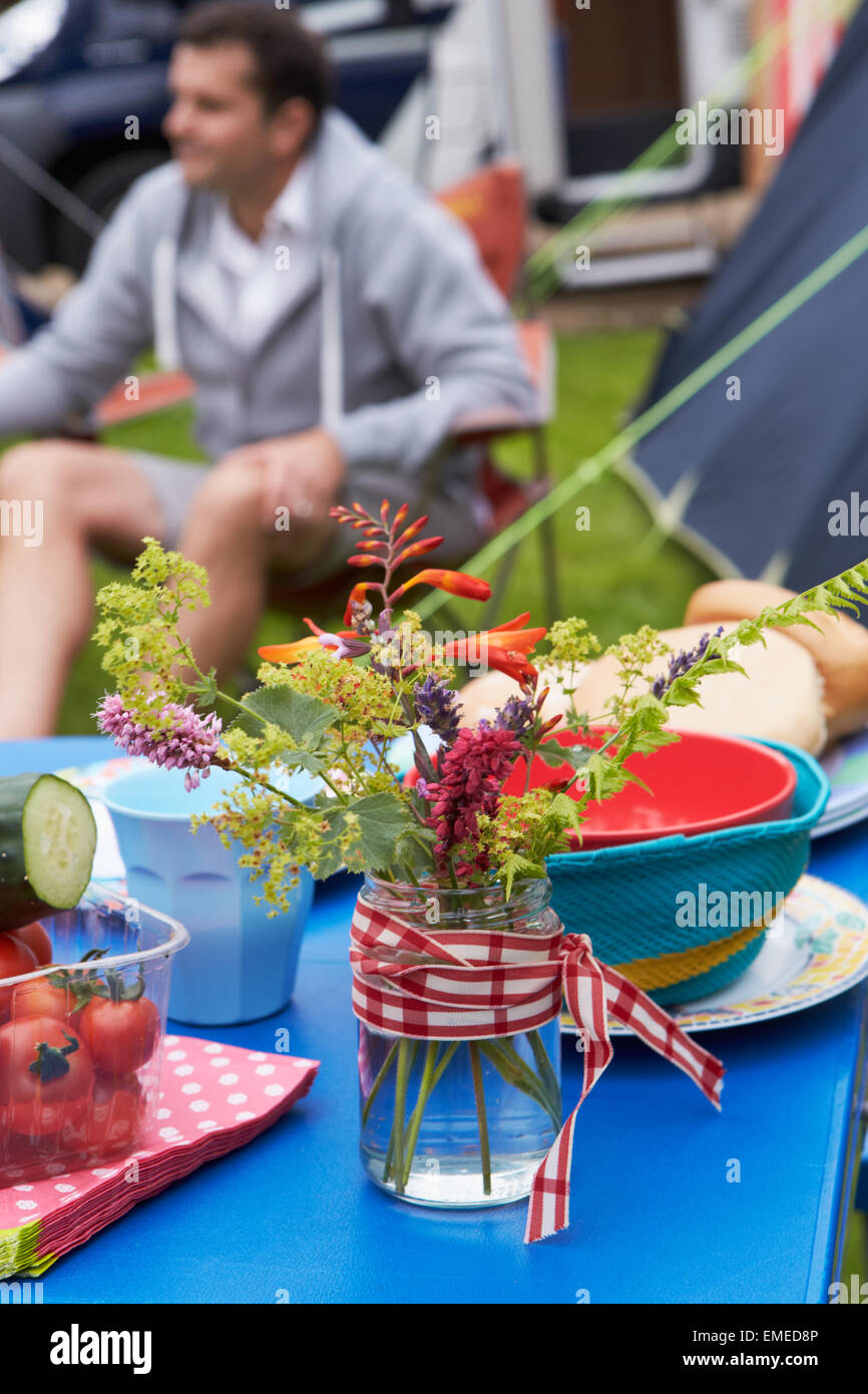 Wild Flowers Decorating Table On Family Camping Holiday Stock Photo