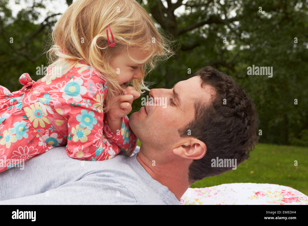 Father With Daughter Relaxing On Camping Holiday Stock Photo - Alamy