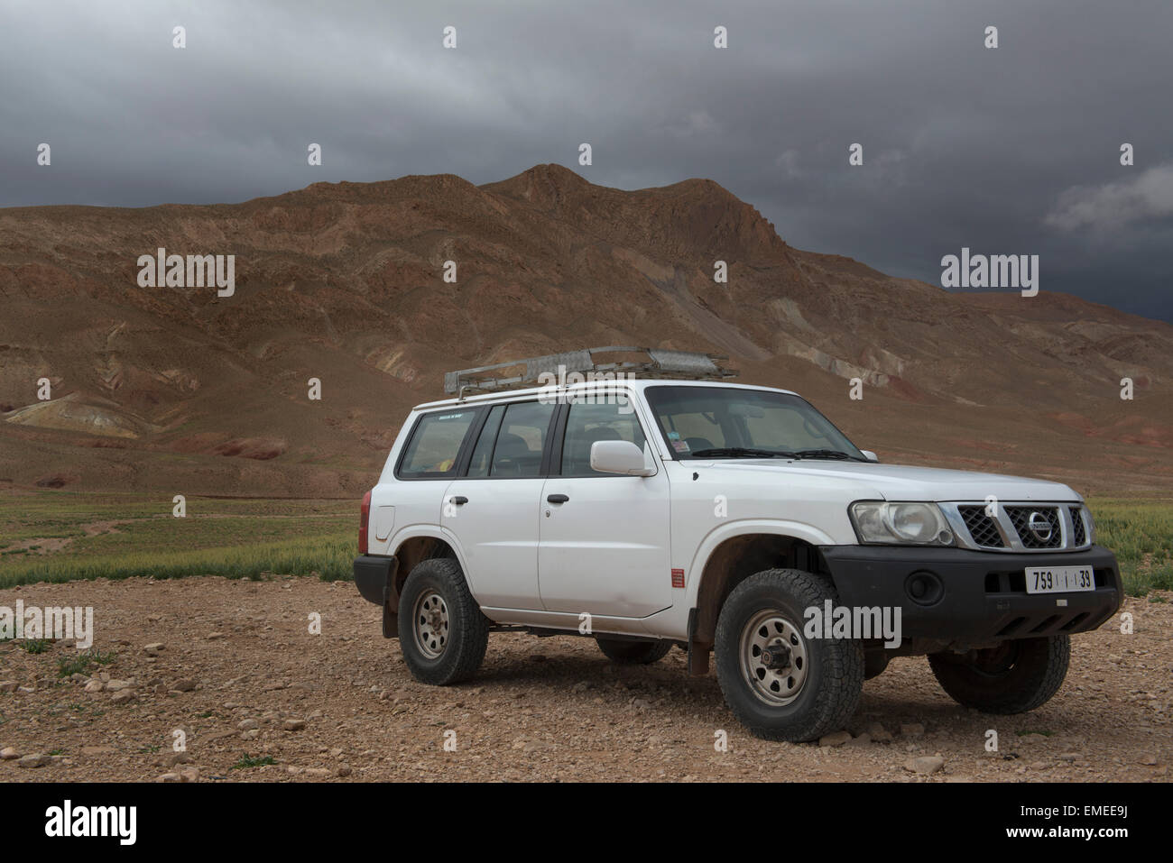 Nissan Pathfinder on dirt road in high Atlas Mountains, Morocco. Stock Photo