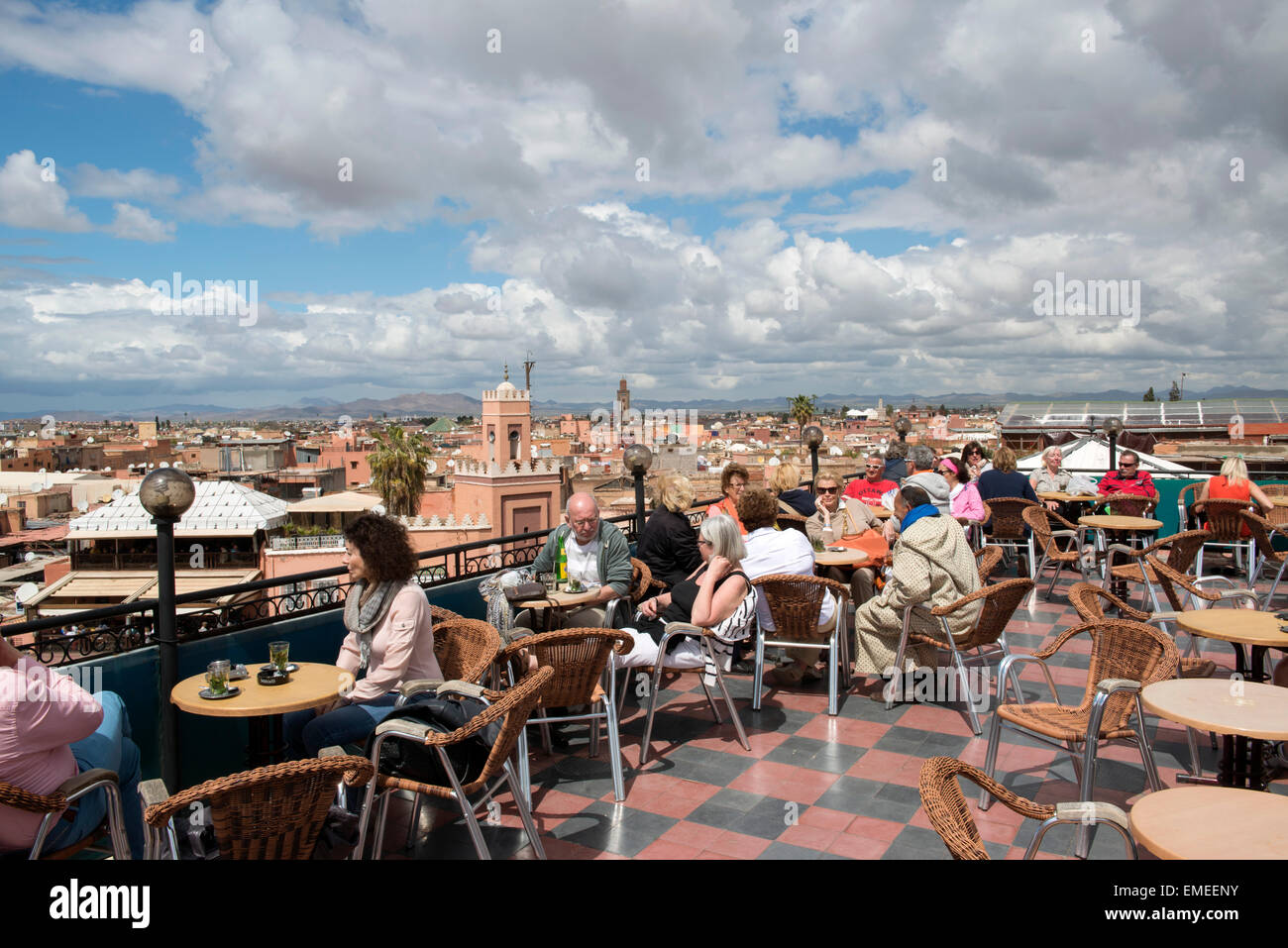 Tourists Sit On Rooftop Terrace At Cafe Du France On Jamaa El Fna 