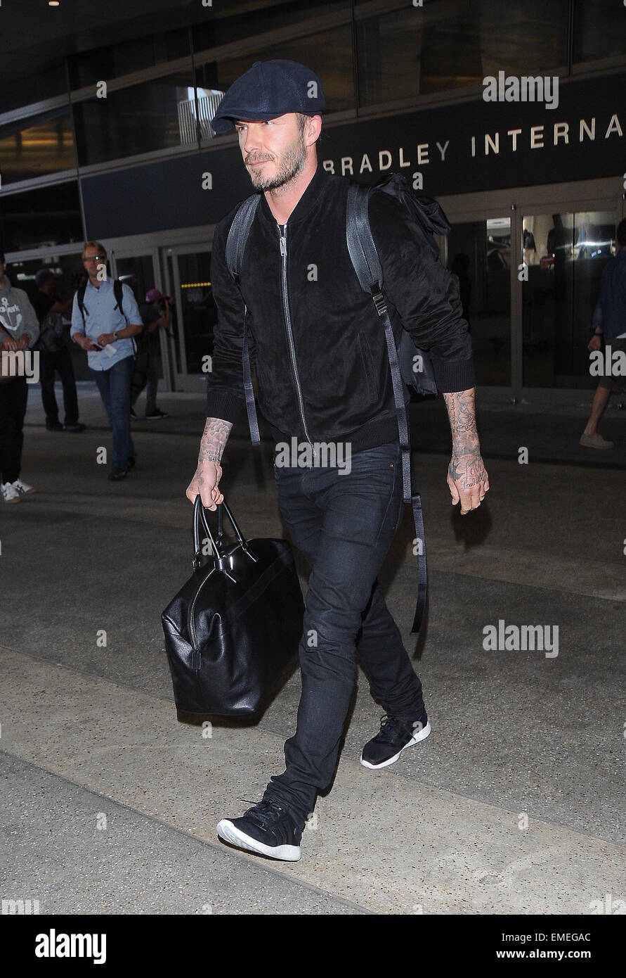 David Beckham arrives at Los Angeles International Airport wearing