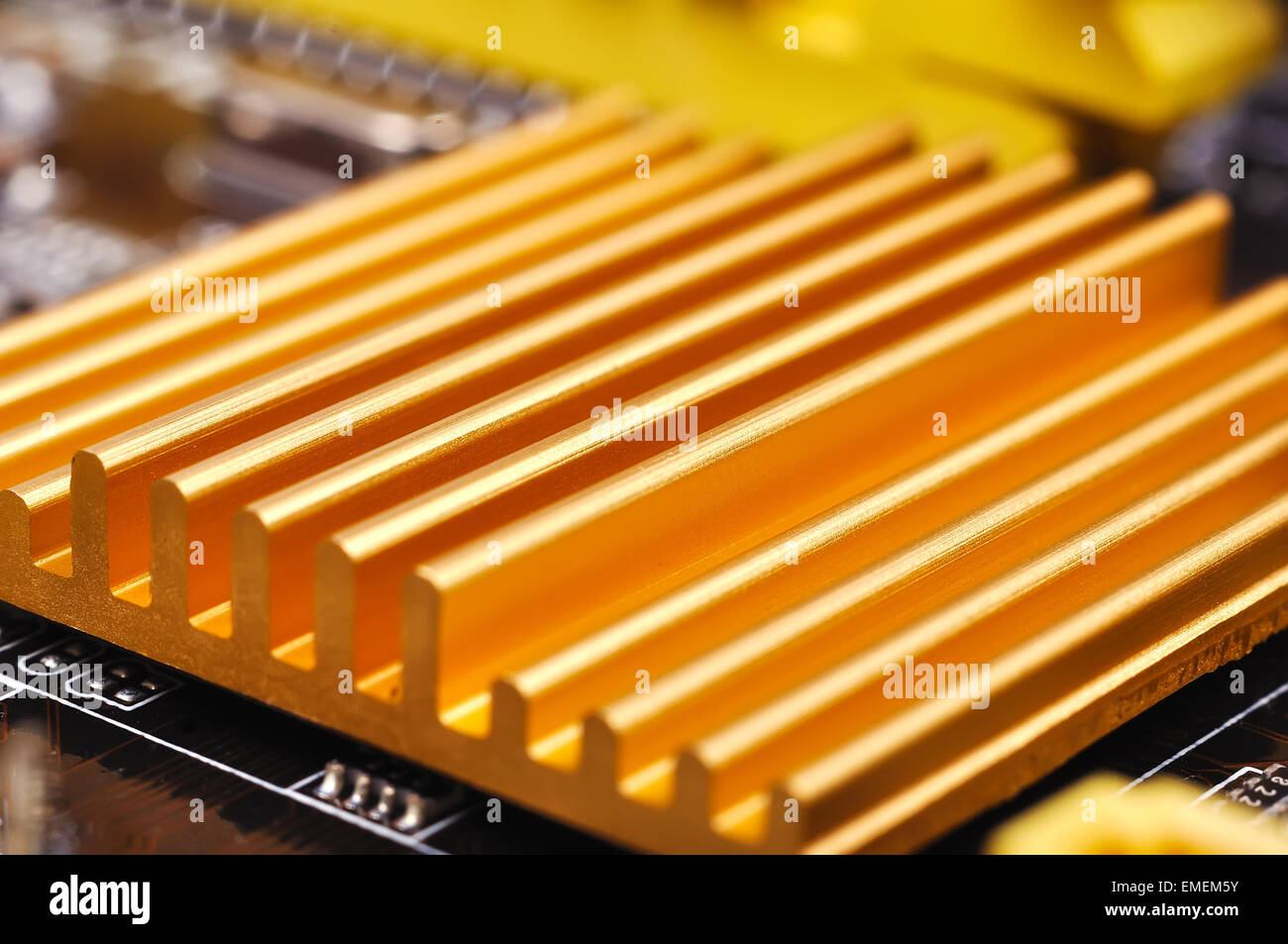 Yellow chipset heatsink on motherboard, close up Stock Photo Alamy