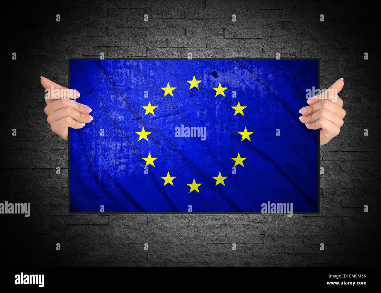 hand holding grunge flag of European Union Stock Photo
