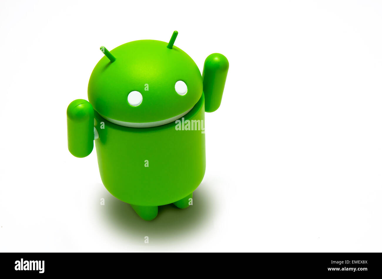 Android robot with his arms up, celebrating victory, isolated over white background Stock Photo