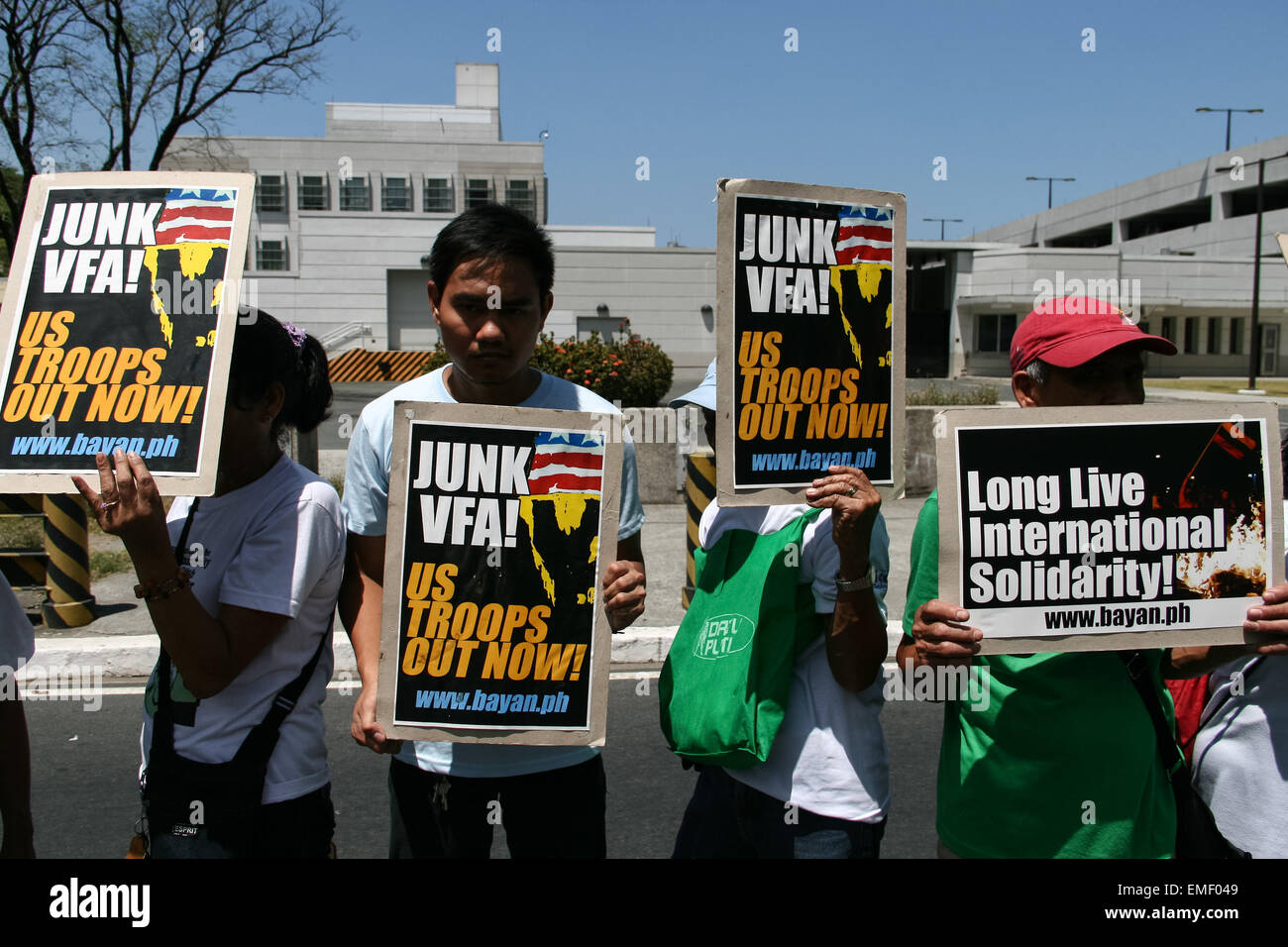 Manila, Philippines. 20th Apr, 2015. Protesters hold posters in fornt of the U.S. embassy in Roxas Boulevard in Manila. Protesters air their sentiments against sanctions the U.S. governemnt imposed over Venezuela, and the start of the Balikatan exercises between the Philippine and U.S. military. Credit:  J Gerard Seguia/Pacific Press/Alamy Live News Stock Photo