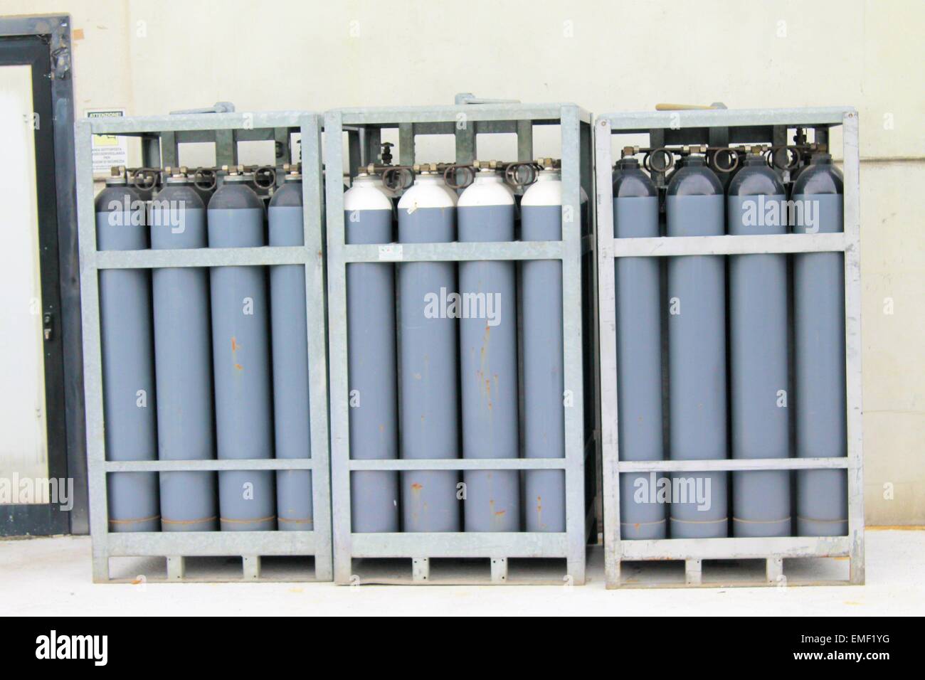 cylinder of oxygen and nitrogen outside of a factory Stock Photo