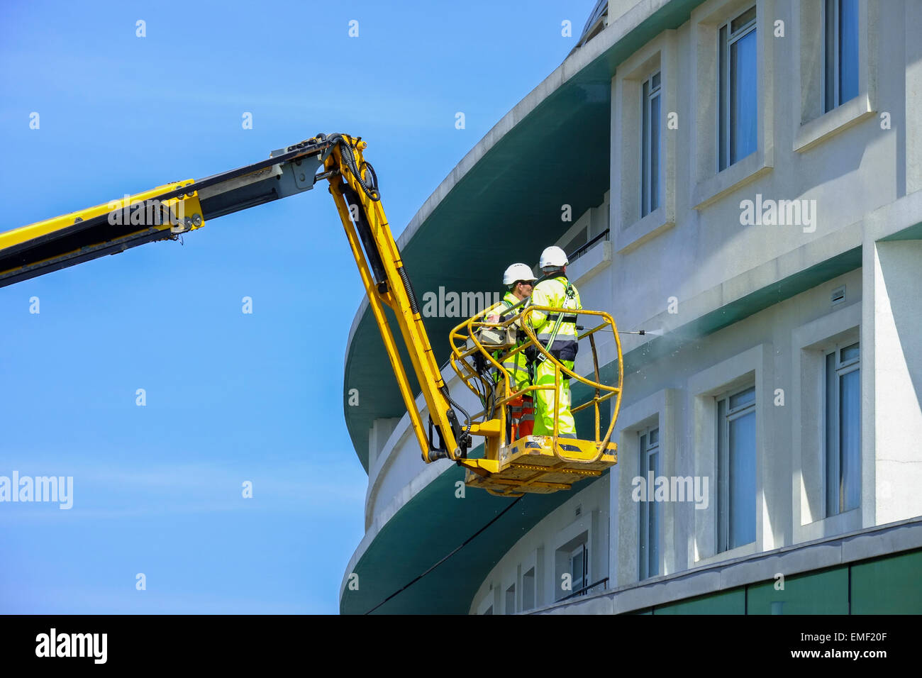 A specialist cleaning company powerwashing the outside of The Midland