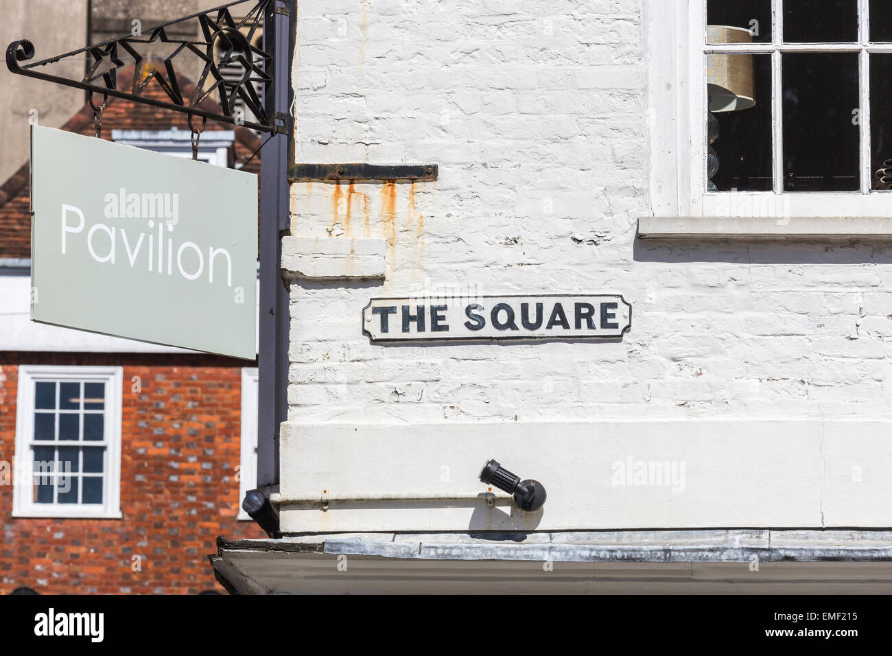 Old fashioned, traditional black and white street sign for The Square on a whitewashed wall in the historic city centre of Winchester, Hampshire, UK Stock Photo