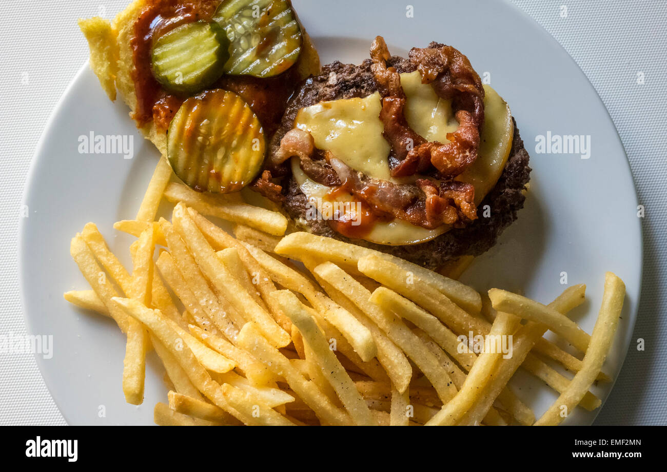 Bacon cheeseburger with French fries Stock Photo