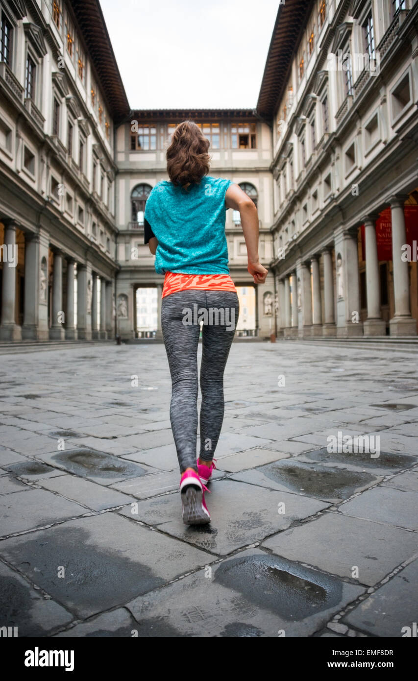 Rear view woman jogging near hi-res stock photography and images - Alamy