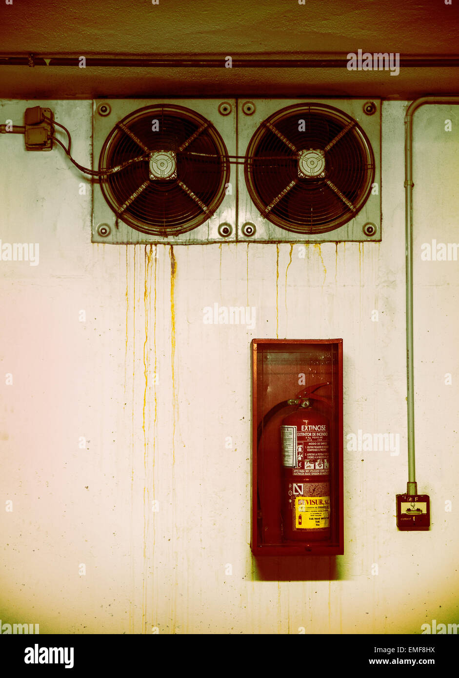 Ventilation Fans And Fire Extinguisher In A Garage Stock Photo