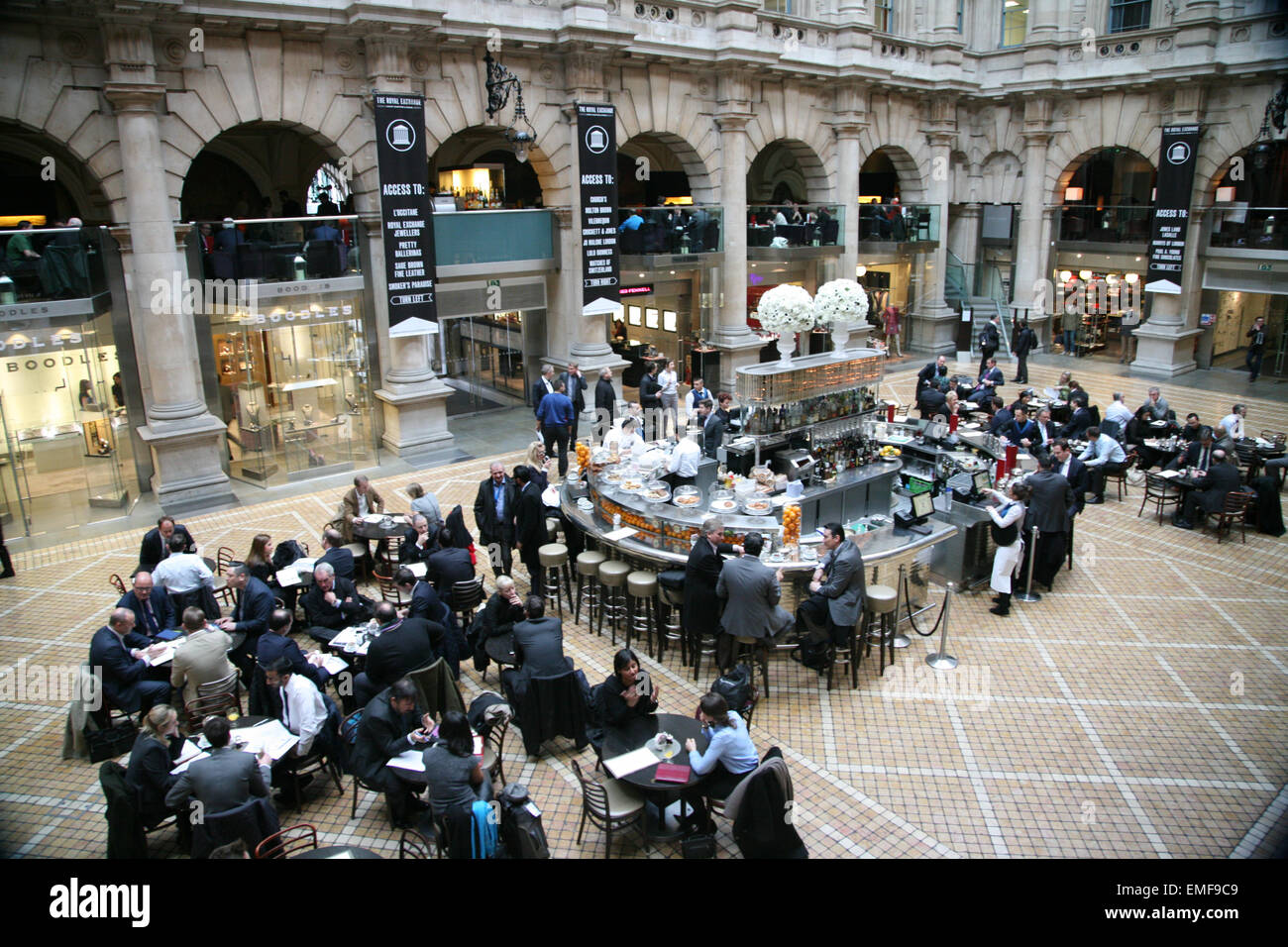 Businesspeople eating lunch at the Royal Exchange Cafe, London, England