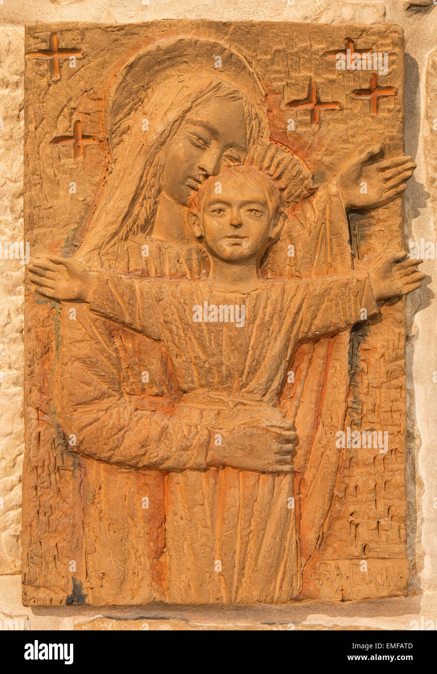 BETHLEHEM, ISRAEL - MARCH 6, 2015: The Madonna with the child. The relief in terracotta  in 'Milk Grotto' chapel by artist P. A. Stock Photo
