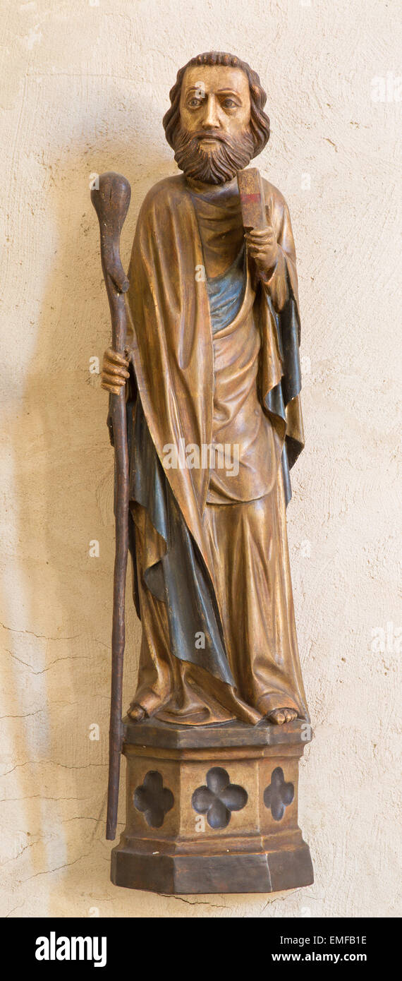 SPISSKY CASTLE, SLOVAKIA - JULY 19, 2014: The gothic carved statue of apostle Jude Thaddeus from castle chapel. Stock Photo