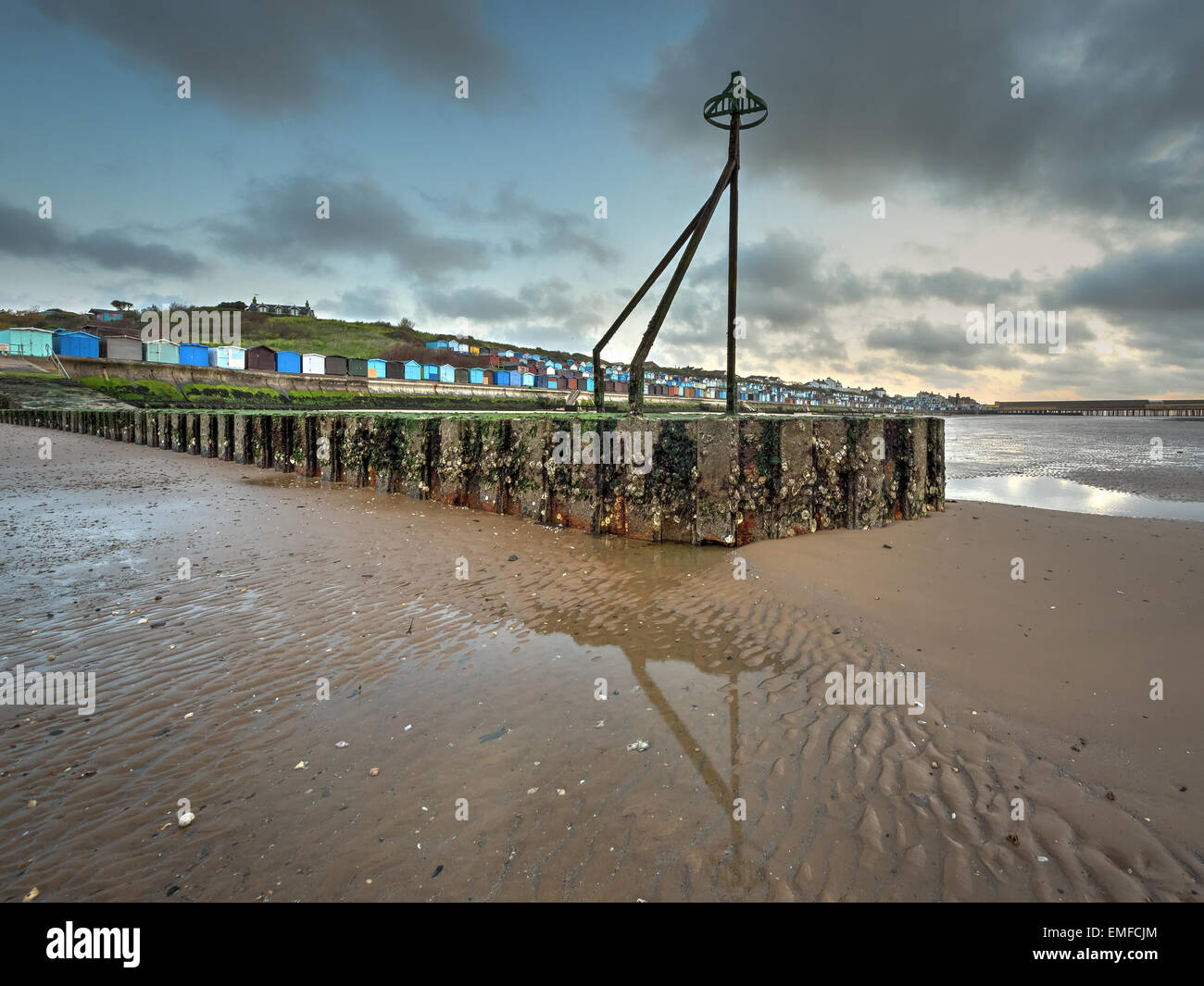 A wonderful sunrise on the beach at low tide from the pier Stock Photo